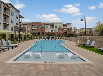 Swimming pool with lounge area and cabanas